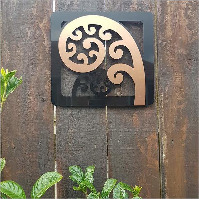 Brushed copper and black Kiwiana frond art panels, 300mm tall, perfect for indoor/outdoor decor, lightweight and durable.