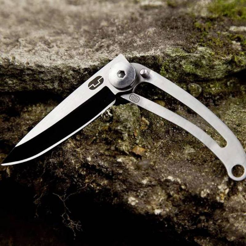 Compact stainless steel folding knife with keyring, features a lock for safety, and a sleek minimalist design.