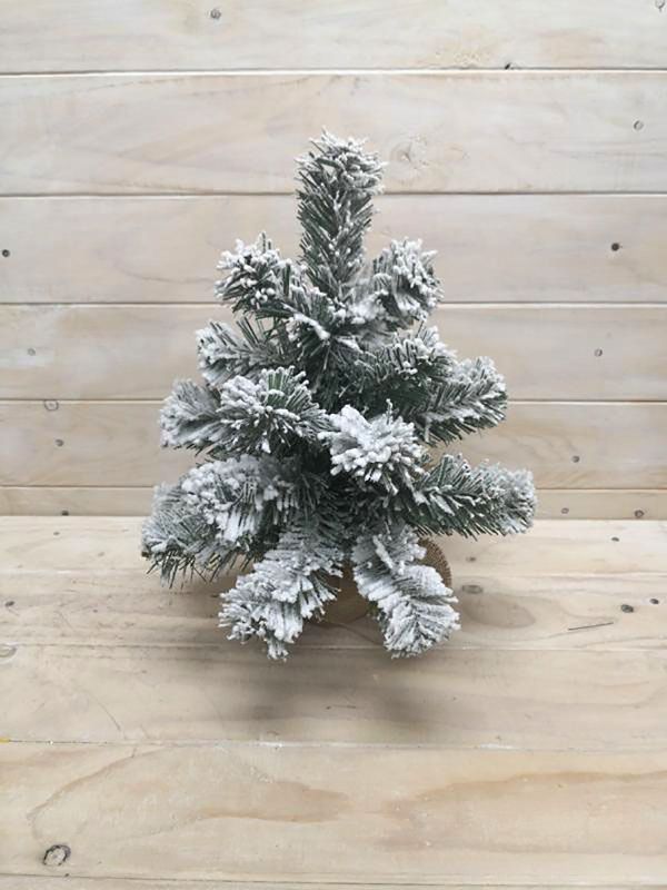 12-inch artificial snowy pine tree with burlap base, perfect for winter decor and low-light spaces.