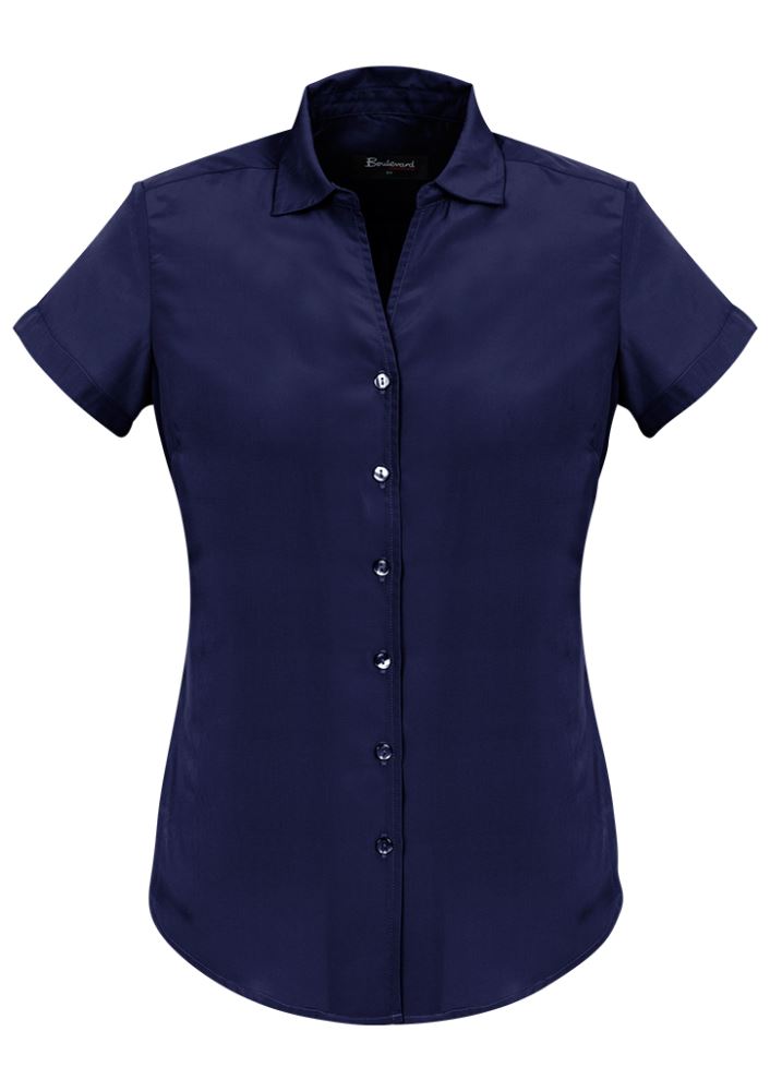 Patriot Blue short sleeve shirt for ladies, semi-fitted with polyester fabric, featuring pleat details for comfort and style.
