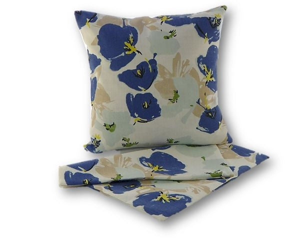 Set of 2 blue flower cushion covers in thick calico fabric, featuring floral patterns and easy-access zips for washing.