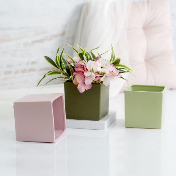 Ceramic cube pot in soft pink with satin matte finish, perfect for small plants or decorative accents, measuring 12x12x12cm.