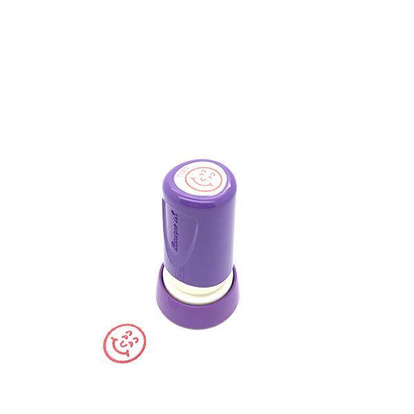 Xstamper Merit Stamp Set featuring 6 vibrant red smiley face stamps for motivating students and enhancing creative projects.