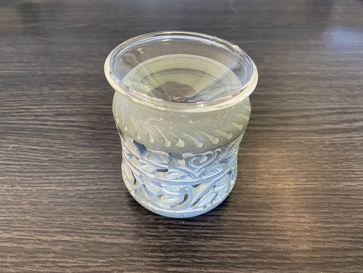 Elegant soapstone aroma therapy oil burner with fine carvings, perfect for enhancing ambiance and relaxation.