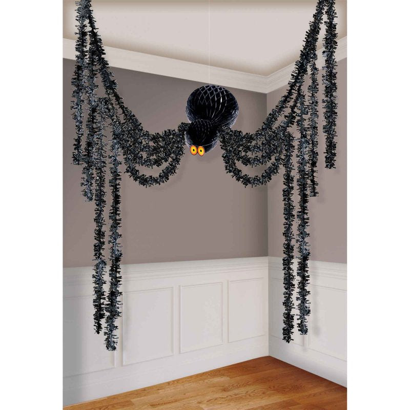 Decorative kit featuring hanging spiders and webs for creating a spooky Halloween atmosphere indoors and outdoors.
