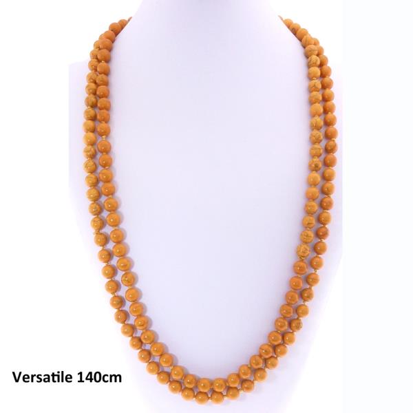 Long necklace featuring unique elongated mustard stones, adding vibrant color and elegance to any outfit.