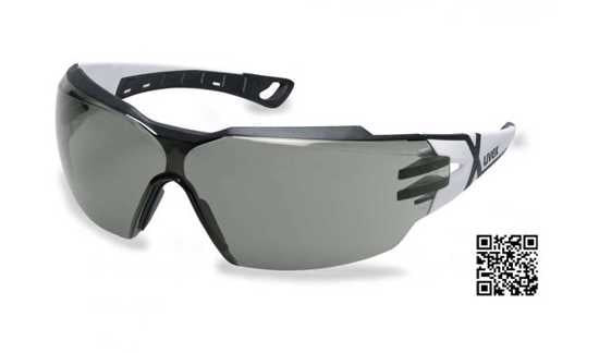 Modern grey uvex pheos cx2 safety glasses with wraparound design, brow guard, and anti-fog, scratch-resistant coating.
