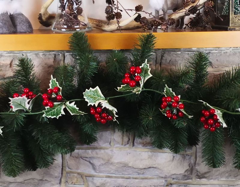 Festive 180cm Holly Garland featuring lush green foliage and vibrant large red berries for holiday decoration.