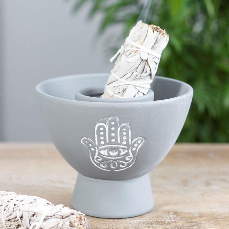 Handmade grey terracotta smudge bowl with Hamsa design, ideal for burning herbs or holding smudge sticks during rituals.