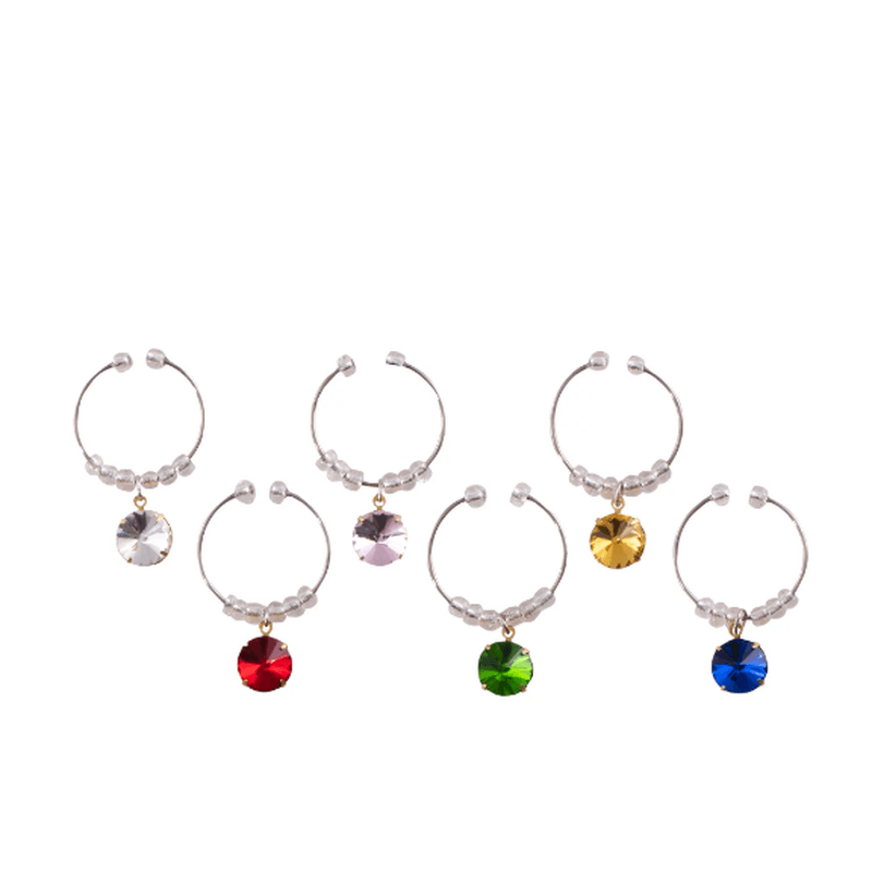 Colorful set of six reusable wine charms with gemstone designs, made from flexible stainless steel for easy glass identification.