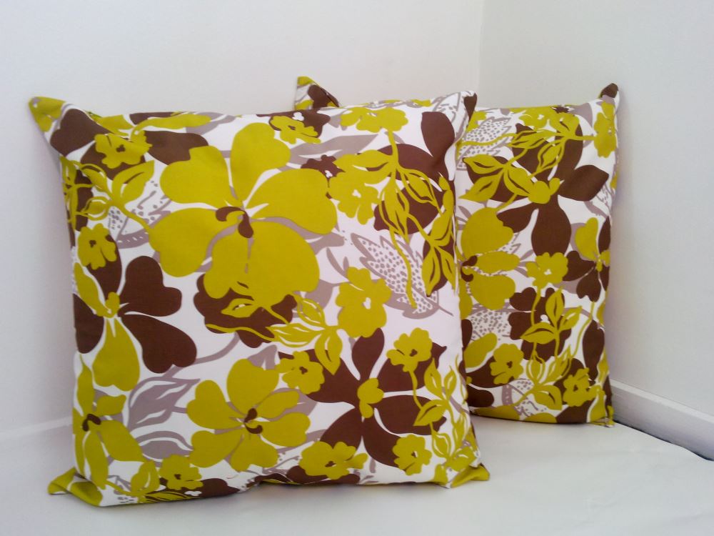 Set of 2 lime green cushion covers with mixed leaf prints, made from thick linen, featuring a zip for easy washing.