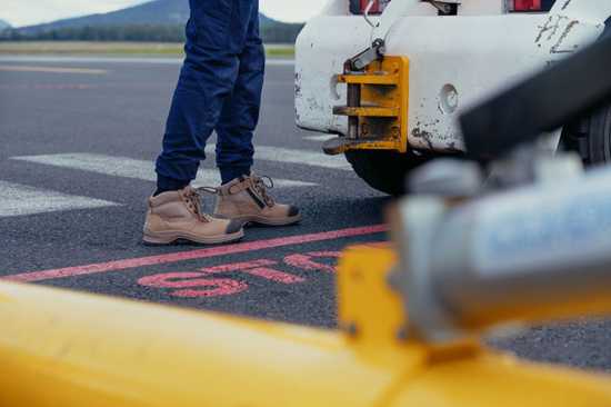 Blundstone #325 Zip Sided Safety Boots in Stone color, featuring steel toe, slip-resistant outsole, and convenient zip design.