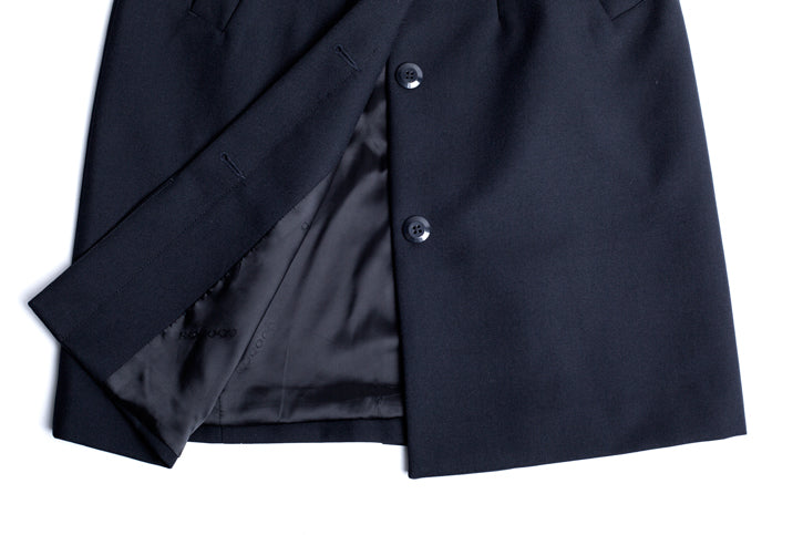 Ladies Lined Overcoat in Midnight, crafted from wool-polyester blend, features a sleek design, jacquard lining, and practical pockets.