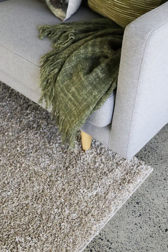 Plush Stirling Almond floor rug (230cm) in polypropylene, featuring a 30mm pile and bound edges for a cozy, stylish decor.