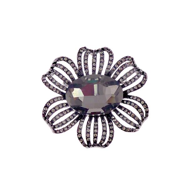 Gunmetal flower brooch with a sparkling black diamond center and crystal petals, measuring 5.5 cm in diameter.