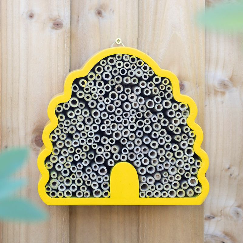 Beehive-shaped bee house for solitary bees, made from FSC-certified materials, enhancing gardens and supporting biodiversity.