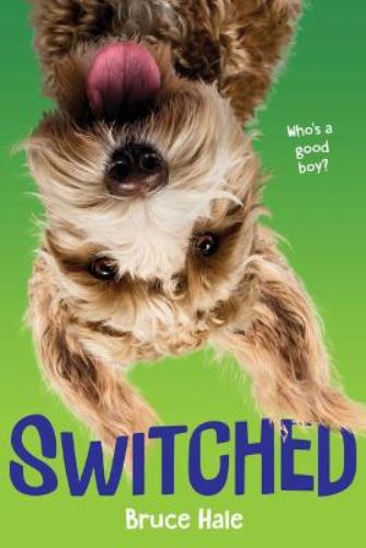 A hardback children's book 'Switched,' featuring Parker and a goldendoodle in a comical body-switching adventure.