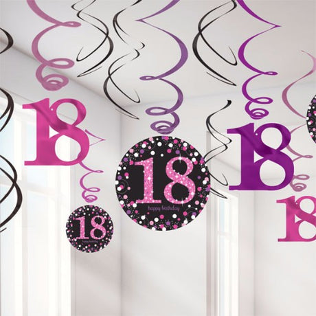 Sparkling pink hanging swirls for 18th birthday, featuring foil designs and cutouts for festive party decor. Pack of 12.