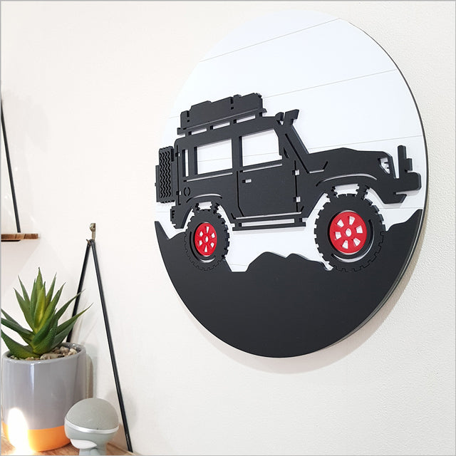 Wall art depicting a rugged Jeep in a circular design, perfect for nursery or bedroom decor, made from ACM and acrylic.