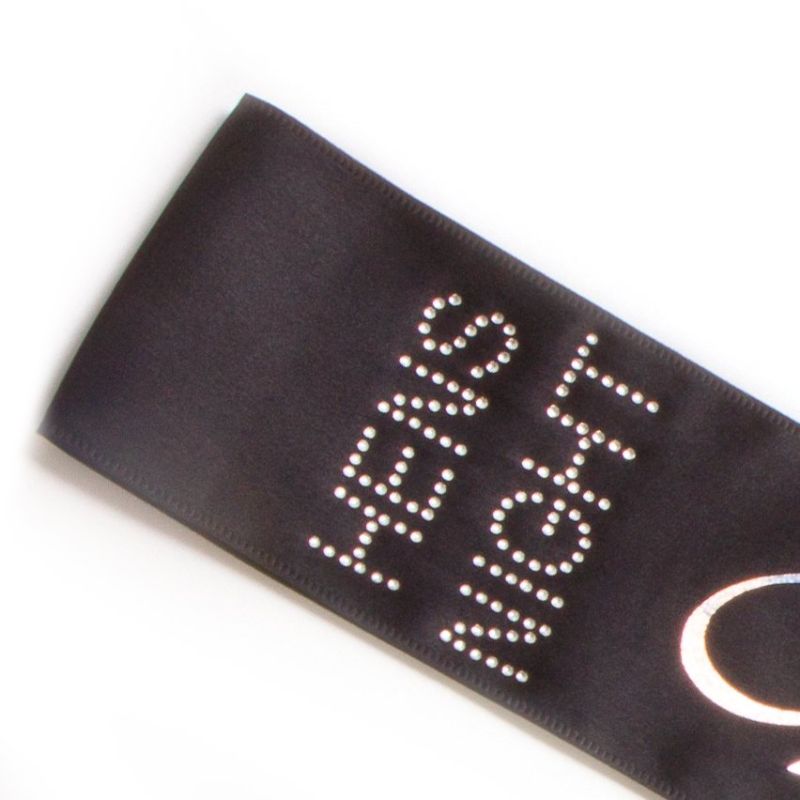 Bride To Be Sash in black with LED lights, silver glitter text, perfect for bridal celebrations and Hens Nights.
