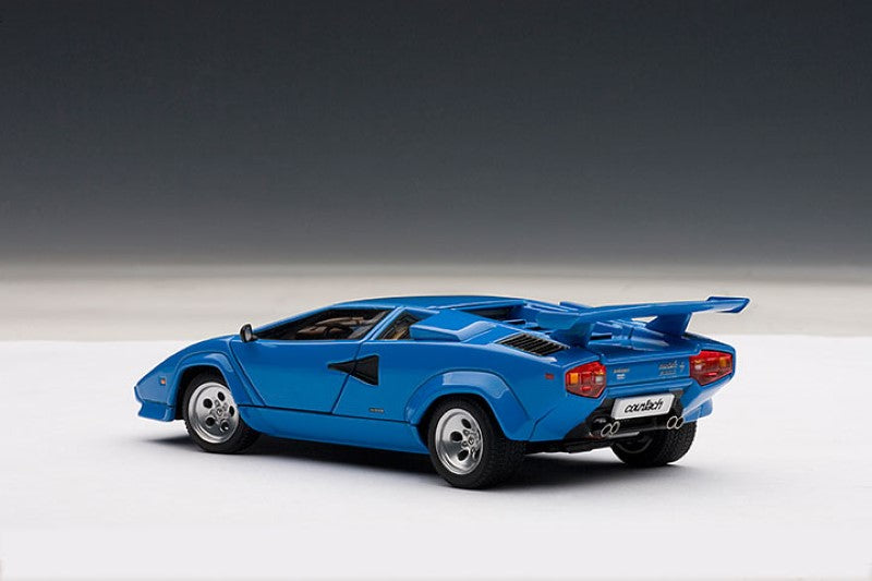 Diecast 1/43 Lamborghini Countach 5000S in blue, featuring opening doors and detailed engine, ideal for collectors.