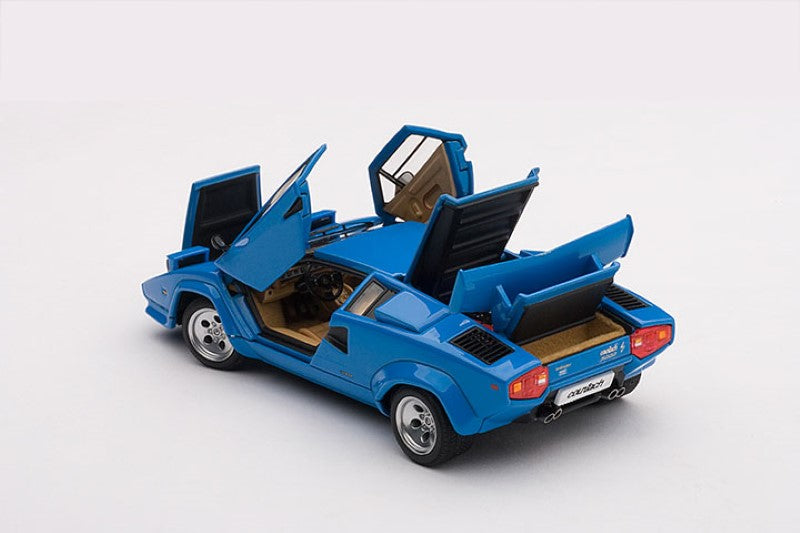 1/43 scale diecast model of the Lamborghini Countach 5000S in blue, featuring opening doors and detailed engine compartment.