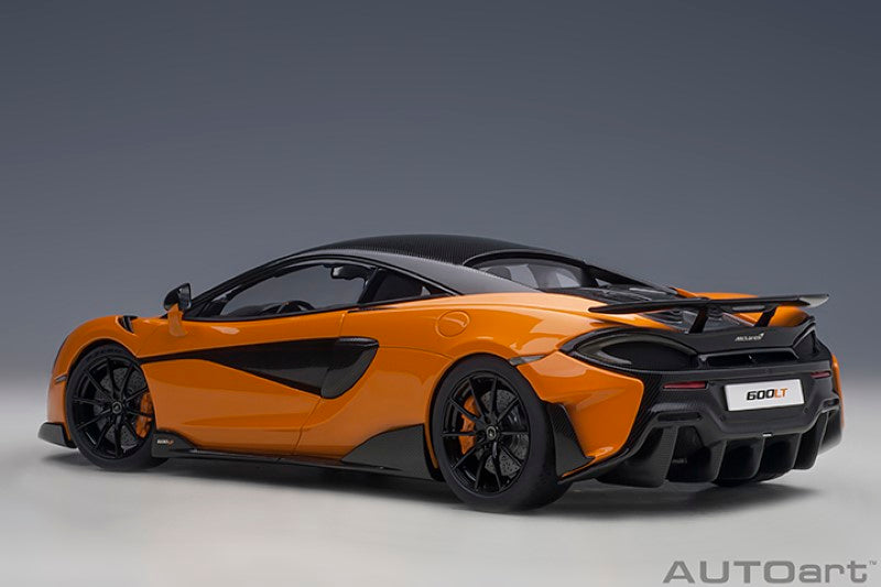 Diecast model of a 1/18 McLaren 600LT in vibrant Myan Orange, showcasing detailed features and authentic craftsmanship.
