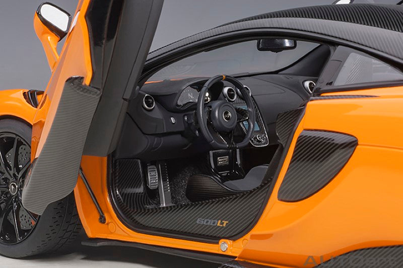 Diecast model of the 1/18 McLaren 600LT in Myan Orange, featuring detailed design and functional moving parts.