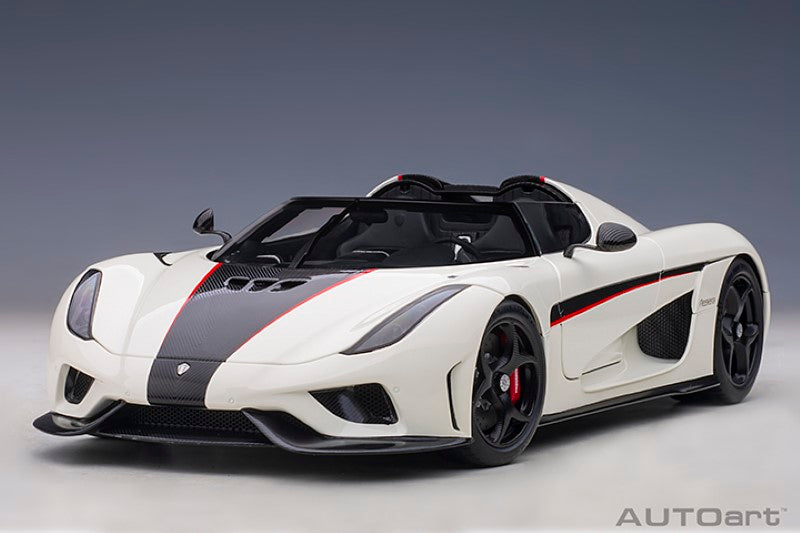 Diecast model of 1/18 Koenigsegg Regera in white with black carbon accents and red details, perfect for collectors.