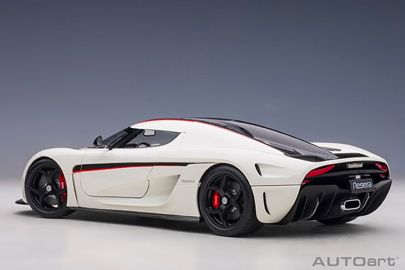1/18 scale diecast model of a white Koenigsegg Regera with black carbon accents and red details, perfect for collectors.