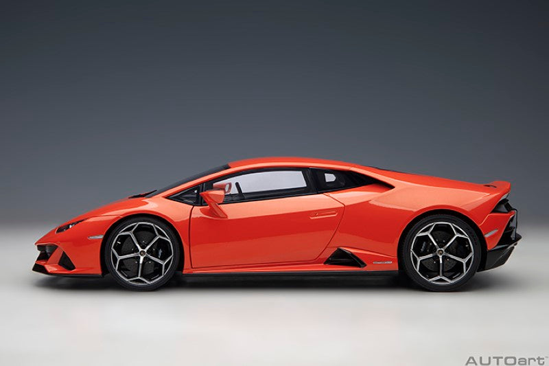 1/18 scale diecast Lamborghini Huracan Evo in vibrant orange, showcasing detailed craftsmanship and luxury sports car design.