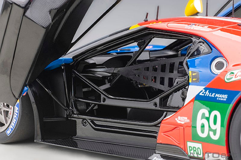 Diecast model of the 2016 Ford GT #69 driven by Scott Dixon, showcasing meticulous detailing and sleek design.