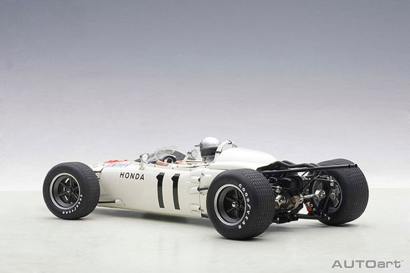 Detailed 1/18 diecast model of '65 Honda RA272, #11 driven by Richie Ginther, with opening hood and driver figure.