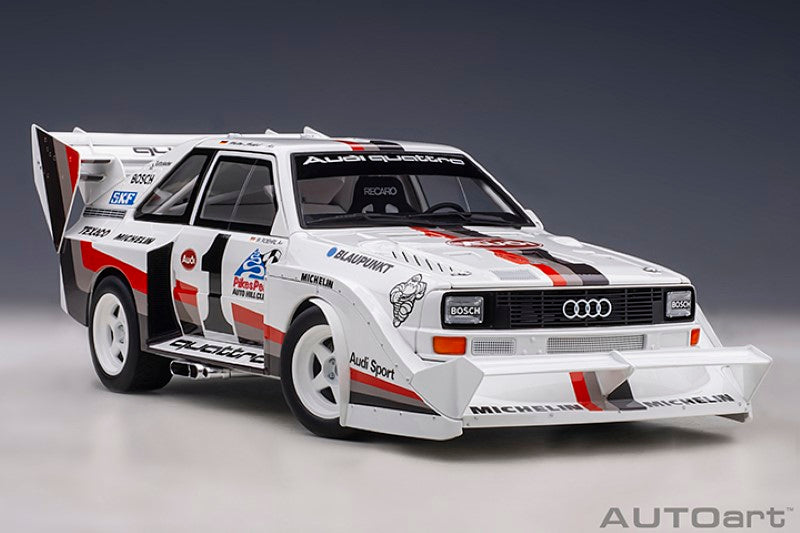 Diecast model of the 1987 Audi Quattro S1 PP #1, showcasing vibrant colors and authentic racing details.