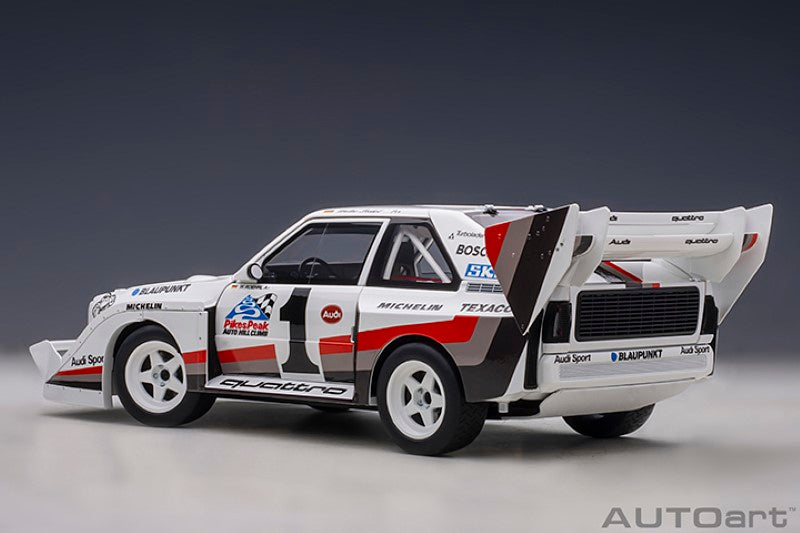 1/18 scale diecast model of the '87 Audi Quattro S1, featuring authentic decals and vibrant colors, celebrating rally racing history.