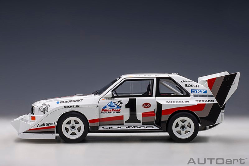Diecast model of the 1987 Audi Quattro S1 #1, showcasing vibrant colors and authentic details from Pikes Peak racing history.