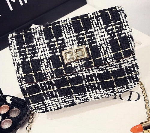 Chic Black & White Check Bag with gold fittings, shoulder chain, and timeless plaid pattern, perfect for any occasion.