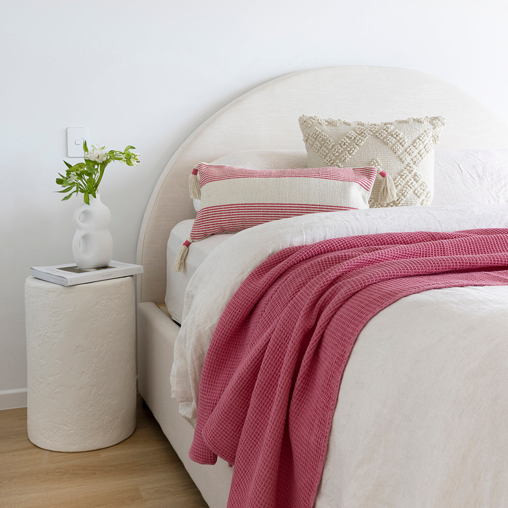 Soft pink cotton waffle throw, 130x180cm, perfect for draping on sofas or beds, adding elegance and warmth to any space.