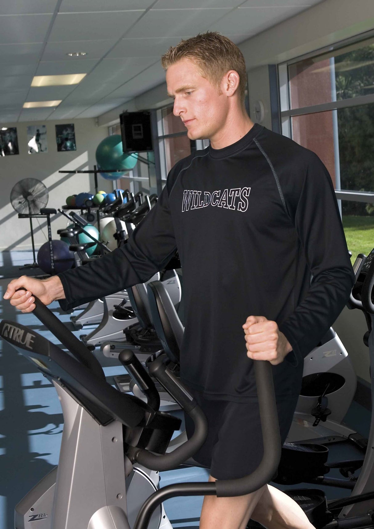 Men's Dri Gear Long Sleeve Tee, made from 100% micro polyester, features moisture-wicking and UV protection for active lifestyles.