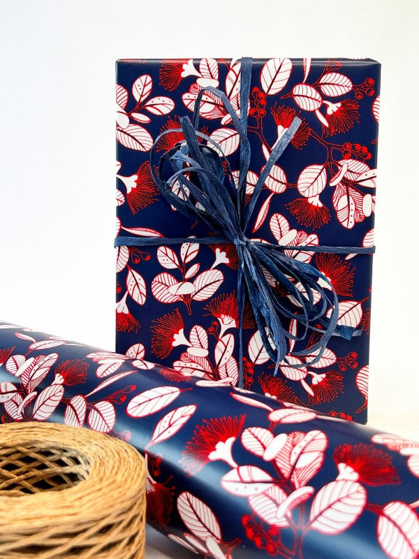 Pohutukawa Wrap in navy red with floral design, ideal for elegant gift wrapping, 600mm x 40m rolls, eco-friendly.
