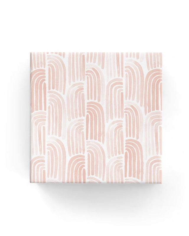 Elegant watercolor arches on matte dusty pink wrapping paper, perfect for stylish gift presentations. 600mm x 40m, eco-friendly.