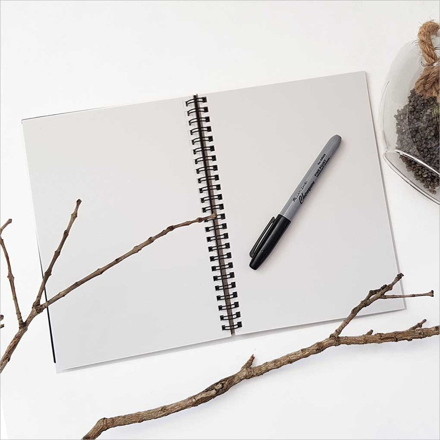 A5 journal featuring a Tui bird on a Koru design, ideal for writing, sketching, and documenting creativity.