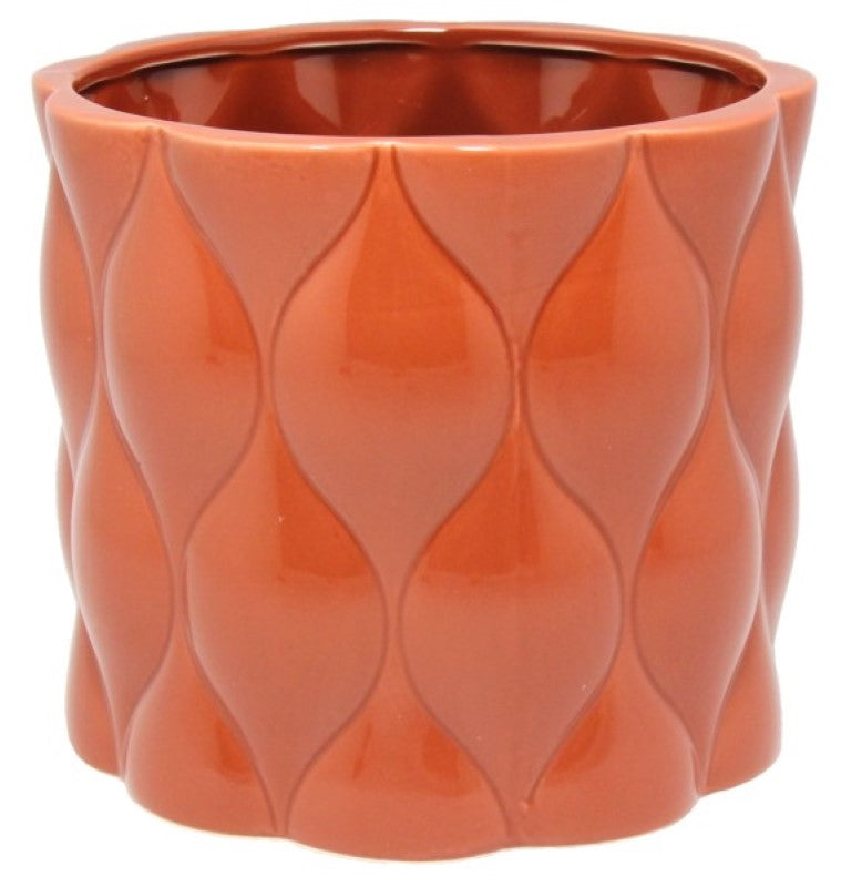 Round ceramic pot in rust with an intricate diamond pattern, perfect for showcasing succulents or flowers.
