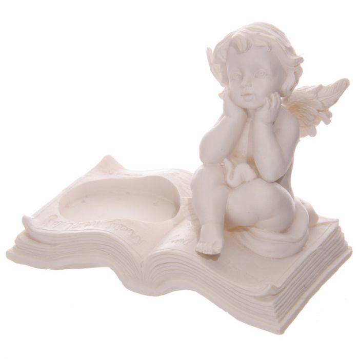 Set of four intricately detailed cherub tea light candle holders, perfect for adding charm and ambiance to any space.