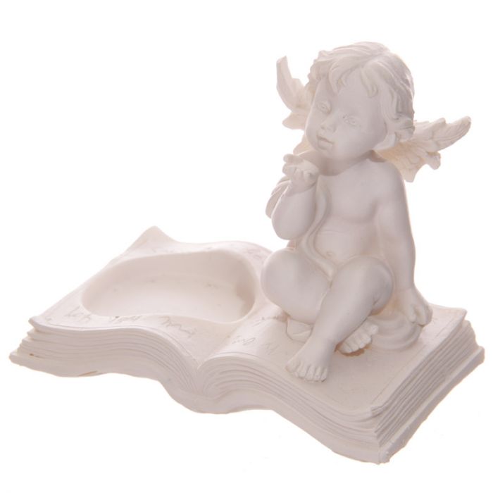 Set of 4 cherub tea light candle holders on books, adding whimsical charm and elegant ambiance to your home decor.