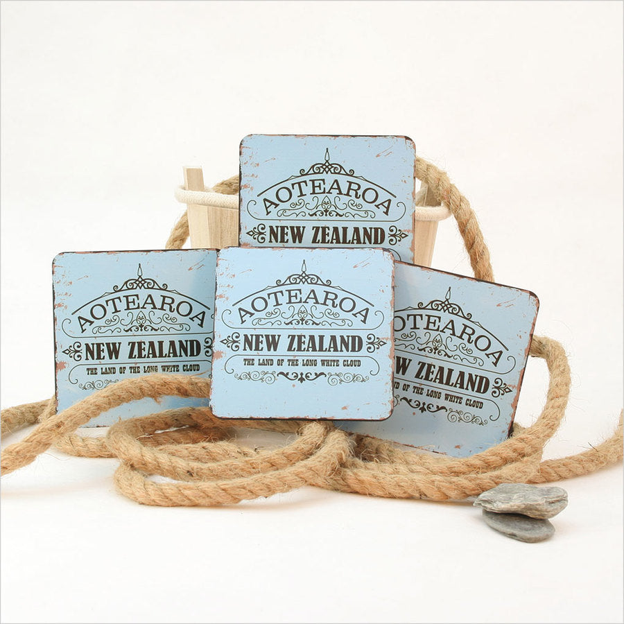 Aotearoa Kiwiana coasters set featuring vibrant designs, crafted from MDF with cork base, ideal for protecting surfaces.