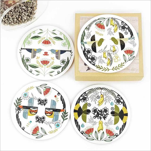 Coasters featuring vibrant folk bird illustrations on 4mm MDF, with a cork base for non-slip protection, 100mm diameter.