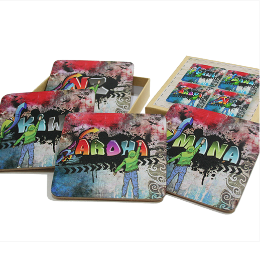 Set of 4 vibrant graffiti print coasters, showcasing New Zealand pride and adding style to any coffee table.