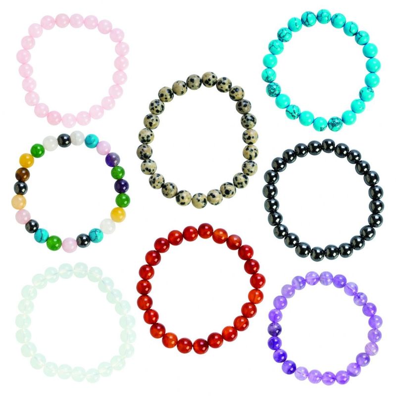 Assorted gemstone bracelets showcasing 8 unique crystals, perfect for stylish stacking or individual wear.