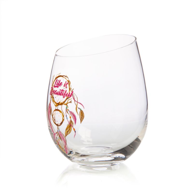 Hand-blown stemless wine glass with dreamcatcher design and angled rim for aeration, perfect for wine enthusiasts.